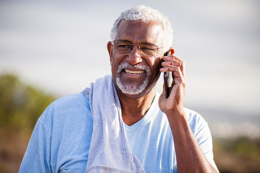 elderly man outside on phone discussing chronic care management