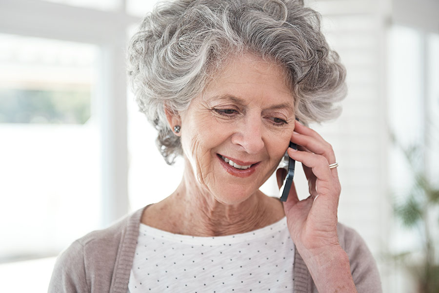elderly woman on phone discussing chronic care management