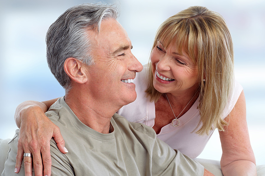 husband and wife happily discussing medical questions